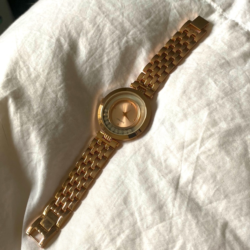 Ellen Tracy watch, has adjustable clasp, rose gold, excellent condition